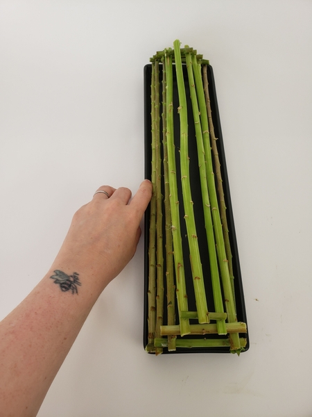 Place the last stem to fill the gap at the top Place the last stem to fill the gap at the top
