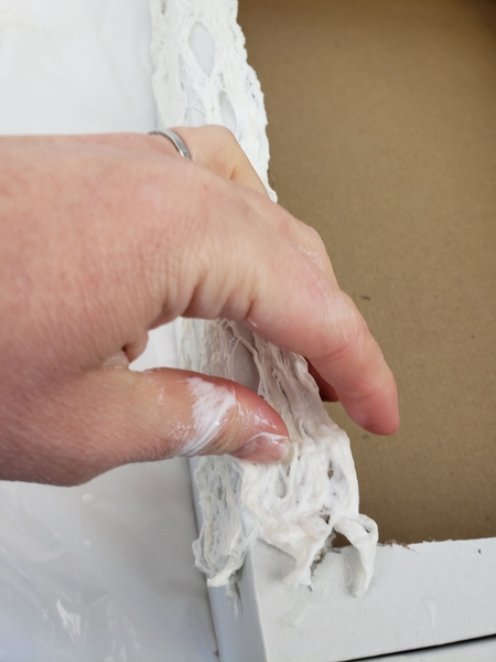 Smooth the soaked bark around the outside of the box Smooth the soaked bark around the outside of the box
