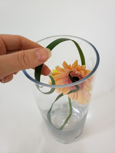 Curl a blade of grass over the container Curl a blade of grass over the container