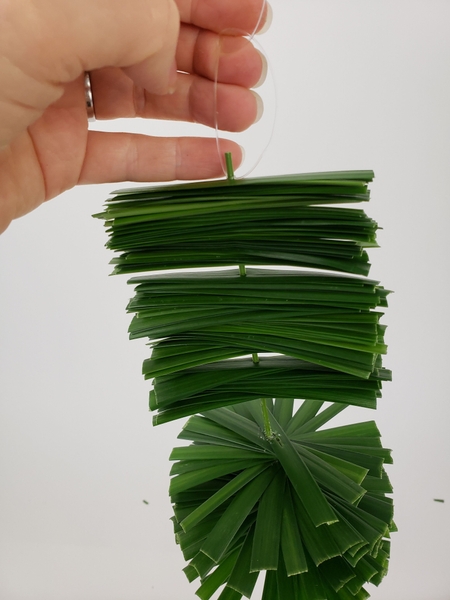 Hang the grass spiral by knotting line to the flexi grass