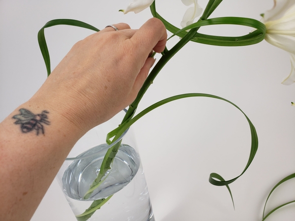 Place the flower stem in a vase Place the flower stem in a vase