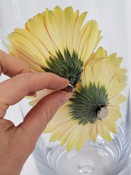 Re-position the flowers once submerged