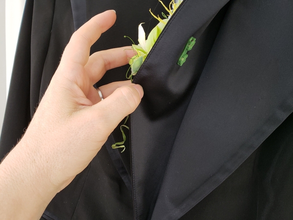And slip the partner magnet behind it under the lapel And slip the partner magnet behind it under the lapel