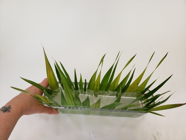 Creating a neat skirt to frame the fresh flowers