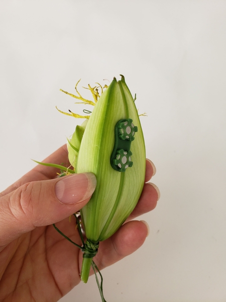 I concealed one half of the magnet inside the flower bud I concealed one half of the magnet inside the flower bud