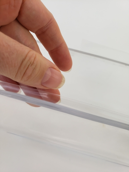 Let the tape extend about half the thickness above the container edge Let the tape extend about half the thickness above the container edge