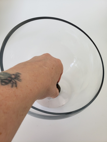 Place a Kenzan in a round glass container Place a Kenzan in a round glass container