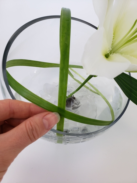 Place the next blade of grass over the first Place the next blade of grass over the first