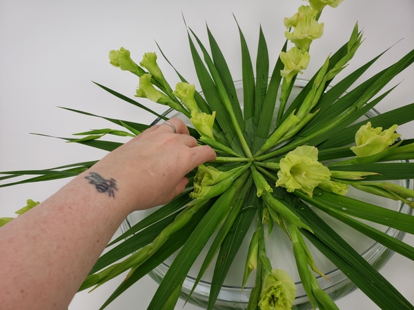 Place the stems so that the stem ends fit in together to create a neat center point. Place the stems so that the stem ends fit in together to create a neat center point.
