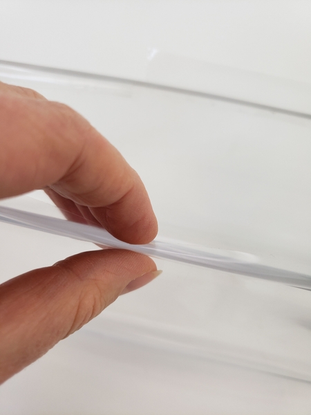 Roll the tape back so that it sticks to itself creating a clear double sided sticky tape Roll the tape back so that it sticks to itself creating a clear double sided sticky tape