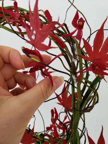 Add the Aranthera orchids into the design Add the Aranthera orchids into the design