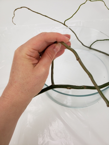 Carefully loop the side twig