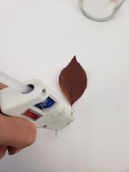 Drop a tiny bead of glue at the very end of the stem you want to attach Drop a tiny bead of glue at the very end of the stem you want to attach