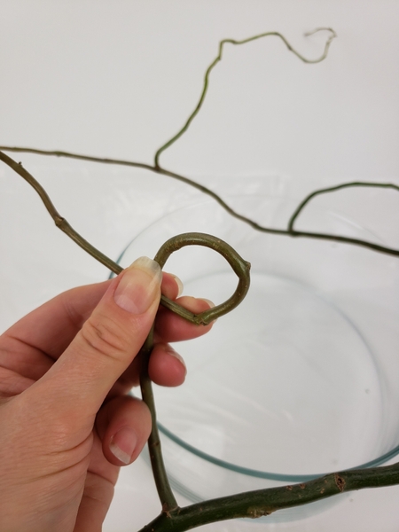 When you can bend it into a circle you can start to weave the tiny wreath