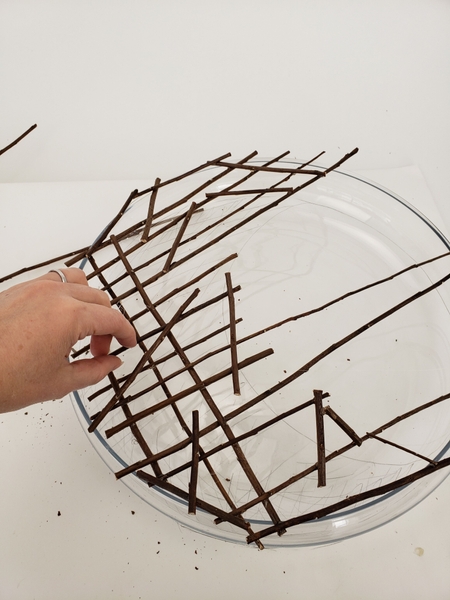 Add in shorter twigs and cross hatch them with the longer twigs Add in shorter twigs and cross hatch them with the longer twigs