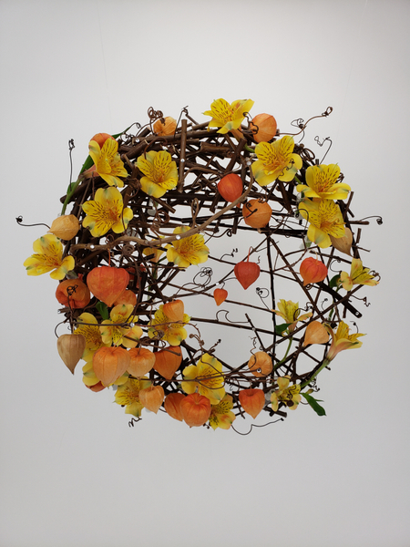 Creative and sustainable contemporary flower arrangement for autumn using twigs and Physalis and Alstroemeria by Christine de Beer