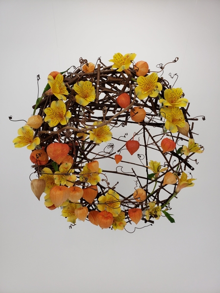 Creative and sustainable contemporary flower arrangement for autumn using twigs and Physalis and Alstroemeria by Christine de Beer