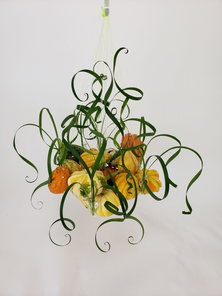 Creative hanging design using small pumpkins Creative hanging design using small pumpkins