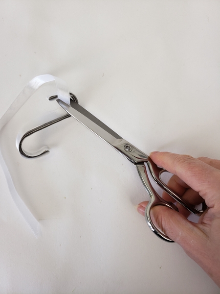 Cut the ribbon straight where the two ends meet Cut the ribbon straight where the two ends meet