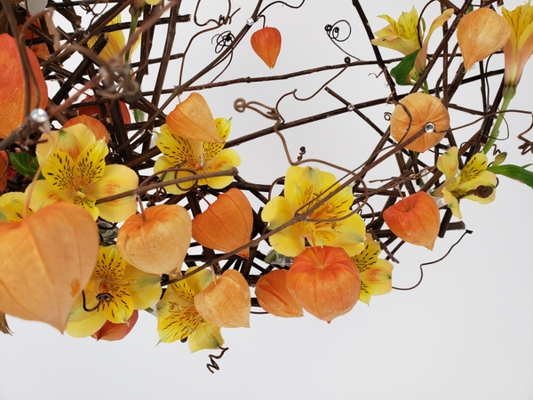 Foam free fall floral design with Physalis and Alstroemeria Foam free fall floral design with Physalis and Alstroemeria