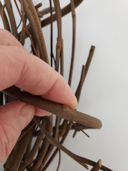 Shave the knot from another twig to create his other eye Shave the knot from another twig to create his other eye