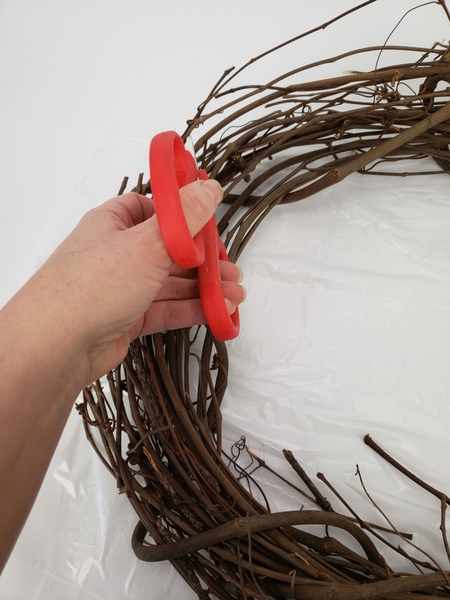 Simply snip the vine on both sides and pull it out of the wreath Simply snip the vine on both sides and pull it out of the wreath