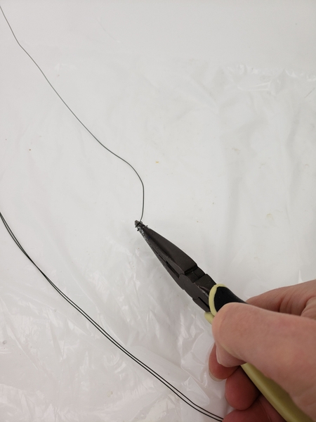 Twist the end of your wire with pliers into a loop Twist the end of your wire with pliers into a loop