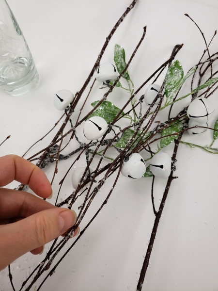 Build up the twig armature by adding the twigs and twisting the wires to secure them in place Build up the twig armature by adding the twigs and twisting the wires to secure them in place