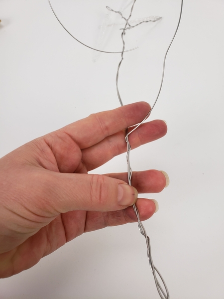 Go back and twist some more wire around the main branch Go back and twist some more wire around the main branch