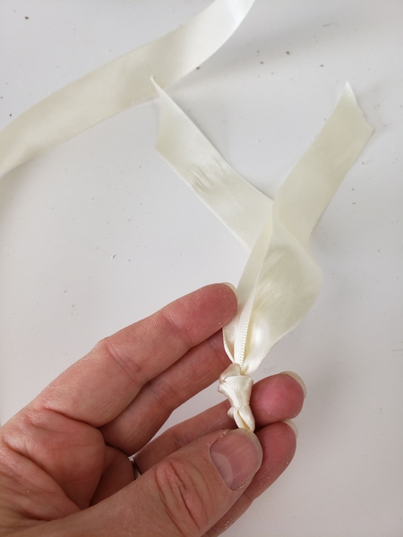 Knot the second section in the middle Knot the second section in the middle