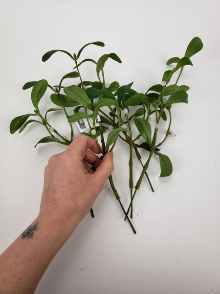 Most artificial branches do not have a very pretty stem end Most artificial branches do not have a very pretty stem end