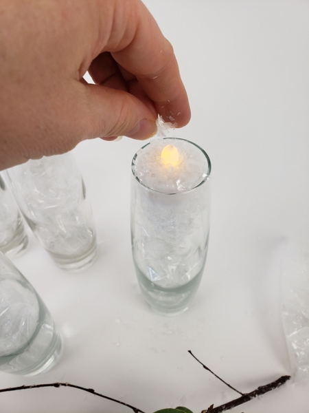 Place it in the vase and sprinkle snow over the top Place it in the vase and sprinkle snow over the top