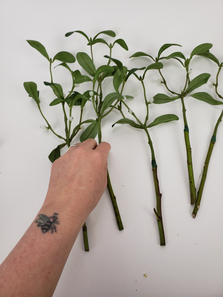 Prepare your faux mistletoe stems so that they are ready to include in the bunch