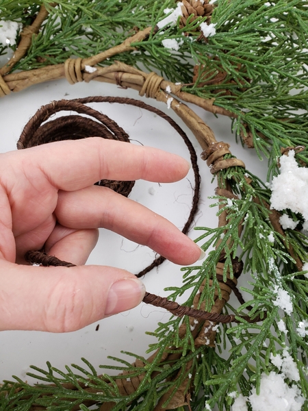 Secure the bark wire to the wreath Secure the bark wire to the wreath