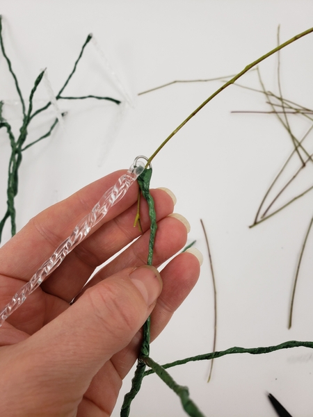 Slip a stem through the hairpin bend in the wire Slip a stem through the hairpin bend in the wire