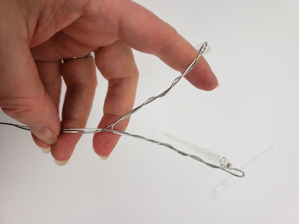 Slip in another icicle to rest in the bend and twist the wire to secure Slip in another icicle to rest in the bend and twist the wire to secure