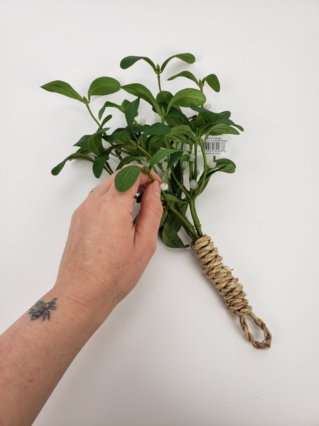 The foundation of my hanging bunch design is build around this faux mistletoe branch The foundation of my hanging bunch design is build around this faux mistletoe branch
