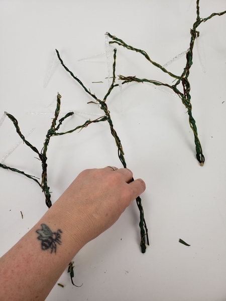 When most of the wire is covered in twigs add the decorative twigs When most of the wire is covered in twigs add the decorative twigs