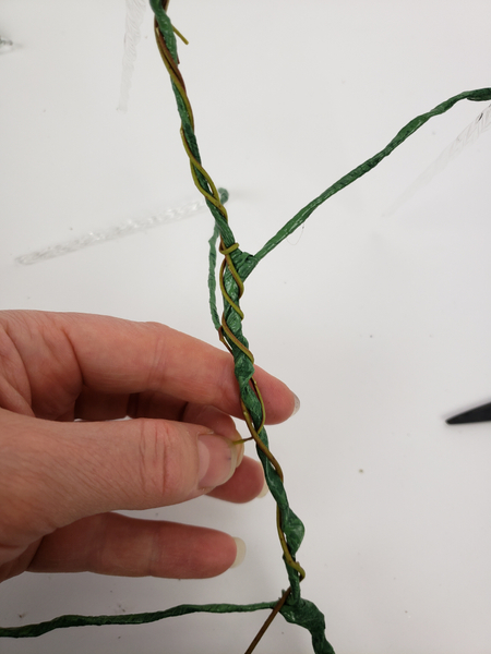 When you get to the end of a weaving stem slip it through a gap in the previous stem to secure