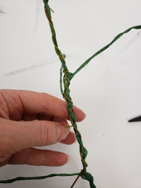 When you get to the end of a weaving stem slip it through a gap in the previous stem to secure