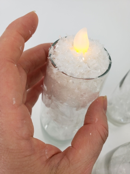 When you remove your hand the vase will be filled with snow When you remove your hand the vase will be filled with snow