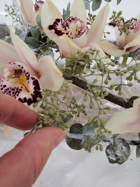Add in dried seeded eucalyptus Add in dried seeded eucalyptus