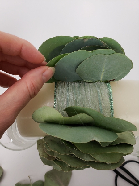 Continue to add the eucalyptus leaves Continue to add the eucalyptus leaves