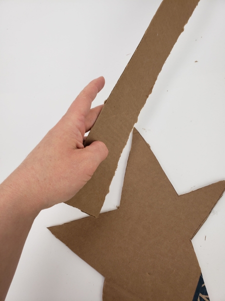 Cut a cardboard strip as thick as you want the basket to be deep.