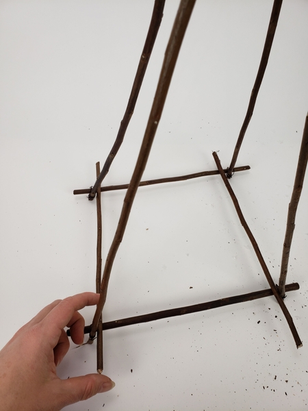 Cut two more twigs to connect the two triangles Cut two more twigs to connect the two triangles