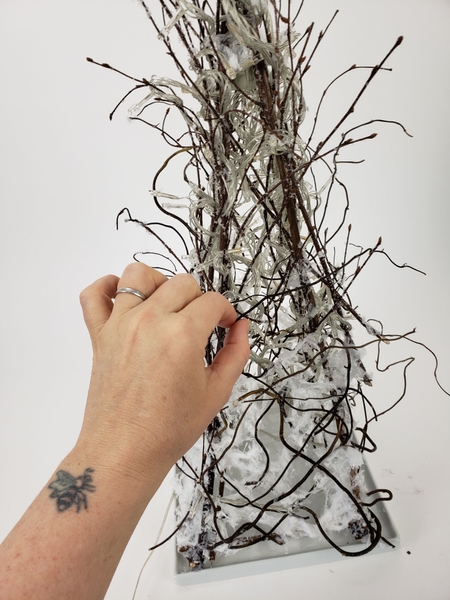 Glue a few longer twigs to grow up the tree Glue a few longer twigs to grow up the tree
