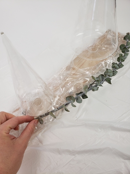 Glue dried twigs to the wrap Glue dried twigs to the wrap