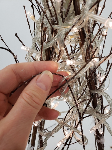 Glue in the next twig to support the wire Glue in the next twig to support the wire