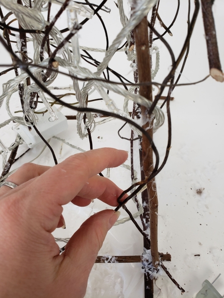 Make sure the twigs keep all the wires securely in place. Make sure the twigs keep all the wires securely in place.
