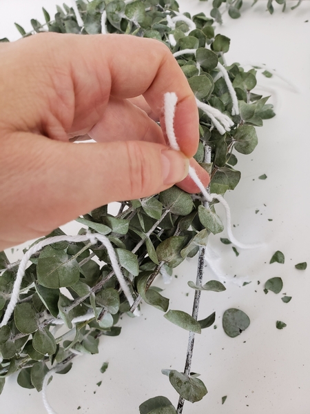 Make sure you tie each stem at three places to the rest of the wreath Make sure you tie each stem at three places to the rest of the wreath